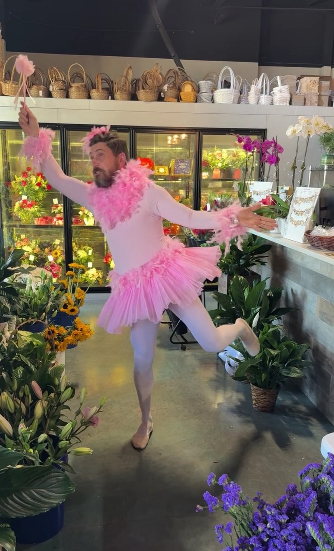 Bearded Ballerina in pink tutu performing a florist singing telegram in Dallas Fort Worth